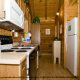 Kitchen View with Refrigerator of Cabin 53 (Berry Special) at Eagles Ridge Resort at Pigeon Forge, Tennessee.