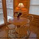 Quaint dining room with a view to enjoy what nature has to offer in cabin 54 (Mountain Majesty), in Pigeon Forge, Tennessee.