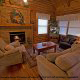 Snuggle up in this living room and watch the hypnotic flames from this fireplace in cabin 54 (Mountain Majesty), in Pigeon Forge, Tennessee.