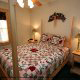Bedroom with Night Stands in Cabin 6 (On Eagles Wings) at Eagles Ridge Resort at Pigeon Forge, Tennessee.