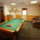 Game Room View with Pool Table in Cabin 6 (On Eagles Wings) at Eagles Ridge Resort at Pigeon Forge, Tennessee.