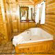 Bathroom View with Jacuzzi of Cabin 70 (Mountain Laurel Hideaway) at Eagles Ridge Resort at Pigeon Forge, Tennessee.