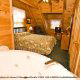Bedroom with Jacuzzi in Cabin 74 (Gerralds Chalet) at Eagles Ridge Resort at Pigeon Forge, Tennessee.