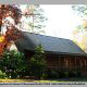 Beautiful front picture of cabin 75 with the sun dawning a new day (Palmetto Place), in Pigeon Forge, Tennessee.