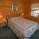 Relax and fall into a restful sleep in this country bedroom in cabin 76 (Bear Tracks), in Pigeon Forge, Tennessee. 