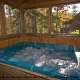 Feel the stress slip away as you relax in this hot tub in cabin 76 (Bear Tracks), in Pigeon Forge, Tennessee. 