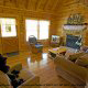 Living room with fireplace in cabin 78 (The Bear Cabin ) , in Pigeon Forge, Tennessee.