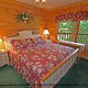 This charming bedroom has that country view in cabin 80 (Heavenly Haven), in Pigeon Forge, Tennessee.