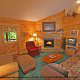 Relax in this lounge chair in the attractive living room in cabin 80 (Heavenly Haven), in Pigeon Forge, Tennessee.