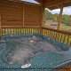 Deck with hot tub in cabin 807 (Blackbeary Ridge) at Eagles Ridge Resort at Pigeon Forge, Tennessee.