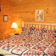 Bedroom with King Size Bed in Cabin 81 (A Piece Of Heaven) at Eagles Ridge Resort at Pigeon Forge, Tennessee.