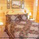 Country bedroom in cabin 815 (As Good As it Gets) at Eagles Ridge Resort at Pigeon Forge, Tennessee.