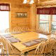 Large dining room in cabin 815 (As Good As it Gets) at Eagles Ridge Resort at Pigeon Forge, Tennessee.