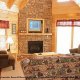 Living room with fireplace in cabin 815 (As Good As it Gets) at Eagles Ridge Resort at Pigeon Forge, Tennessee.
