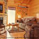 Large living room with fireplace in cabin 818 (Eagles Dream) , in Pigeon Forge, Tennessee.