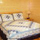 Country bedroom in cabin 821 (Tranquil Times) at Eagles Ridge Resort at Pigeon Forge, Tennessee.