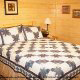 Country bedroom in cabin 821 (Tranquil Times) at Eagles Ridge Resort at Pigeon Forge, Tennessee.