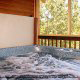 Deck with hot tub in cabin 821 (Tranquil Times) at Eagles Ridge Resort at Pigeon Forge, Tennessee.