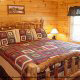 Country bedroom in cabin 826 (Cozy Cabin) , in Pigeon Forge, Tennessee.