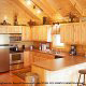 Fully furnished kitchen in cabin 826 (Cozy Cabin) , in Pigeon Forge, Tennessee.