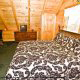 Fall asleep to the sound of nature in this bedroom  in cabin 83 (Sweet Serenity), in Pigeon Forge, Tennessee.