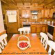 Eat your meals in this dainty country kitchen in cabin 83 (Sweet Serenity), in Pigeon Forge, Tennessee.