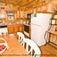 Enjoy eating your supper in this rusty fully furnished kitchen in cabin 83 (Sweet Serenity), in Pigeon Forge, Tennessee.