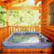 Deck with Hot Tub - Cabin 832 (Lakeside Hideaway) at Eagles Ridge Resort at Pigeon Forge, Tennessee.