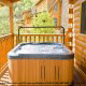 Hot Tub on the Porch View of Cabin 834 (Lakeside Getaway) at Eagles Ridge Resort at Pigeon Forge, Tennessee.