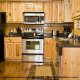 Kitchen View with Refrigerator - Cabin 835 (Lakeside Romance) at Eagles Ridge Resort at Pigeon Forge, Tennessee.