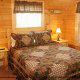 Country bedroom in cabin 838 (Tennessee Escape) at Eagles Ridge Resort at Pigeon Forge, Tennessee.