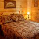 Country bedroom in cabin 838 (Tennessee Escape) at Eagles Ridge Resort at Pigeon Forge, Tennessee.
