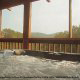 Porch with hot tub in cabin 838 (Tennessee Escape) at Eagles Ridge Resort at Pigeon Forge, Tennessee.