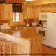 Country kitchen with bar in cabin 838 (Tennessee Escape) at Eagles Ridge Resort at Pigeon Forge, Tennessee.
