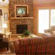 Living room with fireplace in cabin 838 (Tennessee Escape) at Eagles Ridge Resort at Pigeon Forge, Tennessee.