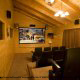 Movie room with huge screen and movie style chairs in cabin 838 (Tennessee Escape) at Eagles Ridge Resort at Pigeon Forge, Tennessee.