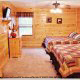 Bedroom with Two Beds in Cabin 842 (Bearfoot Corner) at Eagles Ridge Resort at Pigeon Forge, Tennessee.