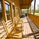 Deck with Rocking Chairs in Cabin 842 (Bearfoot Corner) at Eagles Ridge Resort at Pigeon Forge, Tennessee.