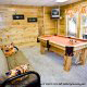 Game Room with Pool Table in Cabin 842 (Bearfoot Corner) at Eagles Ridge Resort at Pigeon Forge, Tennessee.