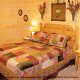 Country Bedroom View of Cabin 844 (Bear Claw Lodge) at Eagles Ridge Resort at Pigeon Forge, Tennessee.