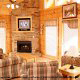 Living room with fireplace in cabin 845 (Eagle Watch) , in Pigeon Forge, Tennessee.