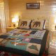 Country Bedroom View of Cabin 849 (Sweet Escape) at Eagles Ridge Resort at Pigeon Forge, Tennessee.