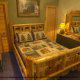 Fall asleep in this charming country bedroom in cabin 85 (Smoky Mountain Getaway), in Pigeon Forge, Tennessee.
