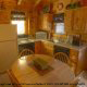 Fully furnished charming country kitchen in cabin 85 (Smoky Mountain Getaway), in Pigeon Forge, Tennessee.