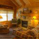 Sit down and relax in the living room in cabin 85 (Smoky Mountain Getaway), in Pigeon Forge, Tennessee.