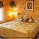 Bedroom with King Size Bed in Cabin 850 (Simply The Best) at Eagles Ridge Resort at Pigeon Forge, Tennessee.