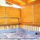 Porch with hot tub in cabin 853 (Beary Cozy) at Eagles Ridge Resort at Pigeon Forge, Tennessee.