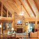 Den with vaulted ceilings and fireplace in cabin 856 (Eagles Pointe) , in Pigeon Forge, Tennessee.