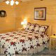 Bedroom with Night Stands in Cabin 858 (Eagles On A High) at Eagles Ridge Resort at Pigeon Forge, Tennessee.