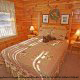 Country bedroom in cabin 859 (Absolute Paradise) , in Pigeon Forge, Tennessee.